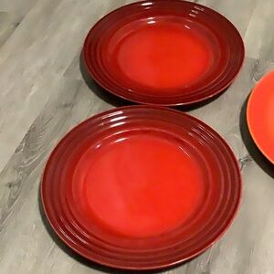Le Creuset set of 2 red 12 inch dinner plates
